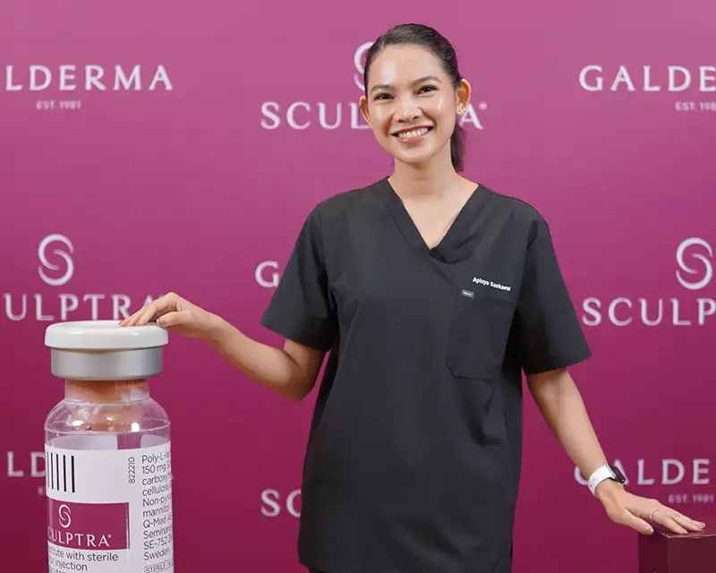 Dr. Tar in black scrubs with oversized Sculptra vial, Galderma-branded magenta backdrop