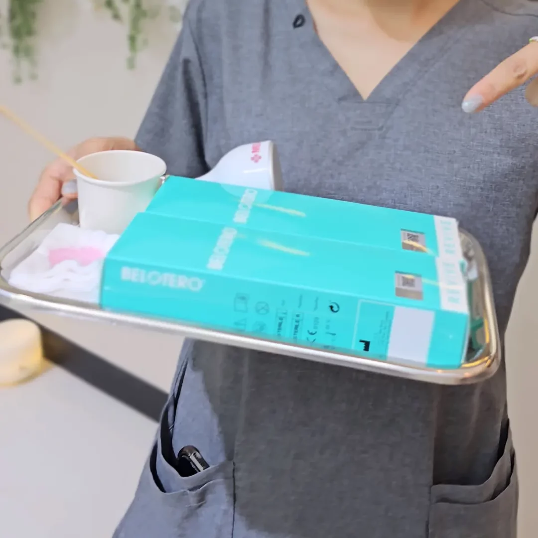 Clinician holding tray with Belotero Revive boxes in clinic