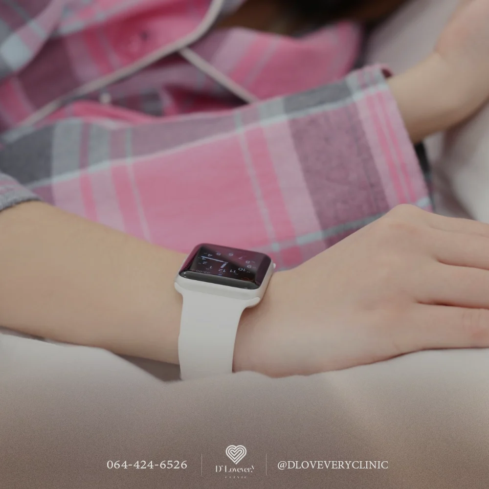 Apple Watch sleep test: white-band watch on wrist with pink plaid pajamas